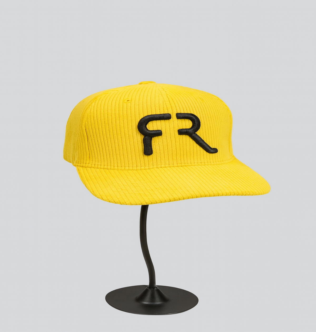 Yellow cap with 'FR' logo on a gray background